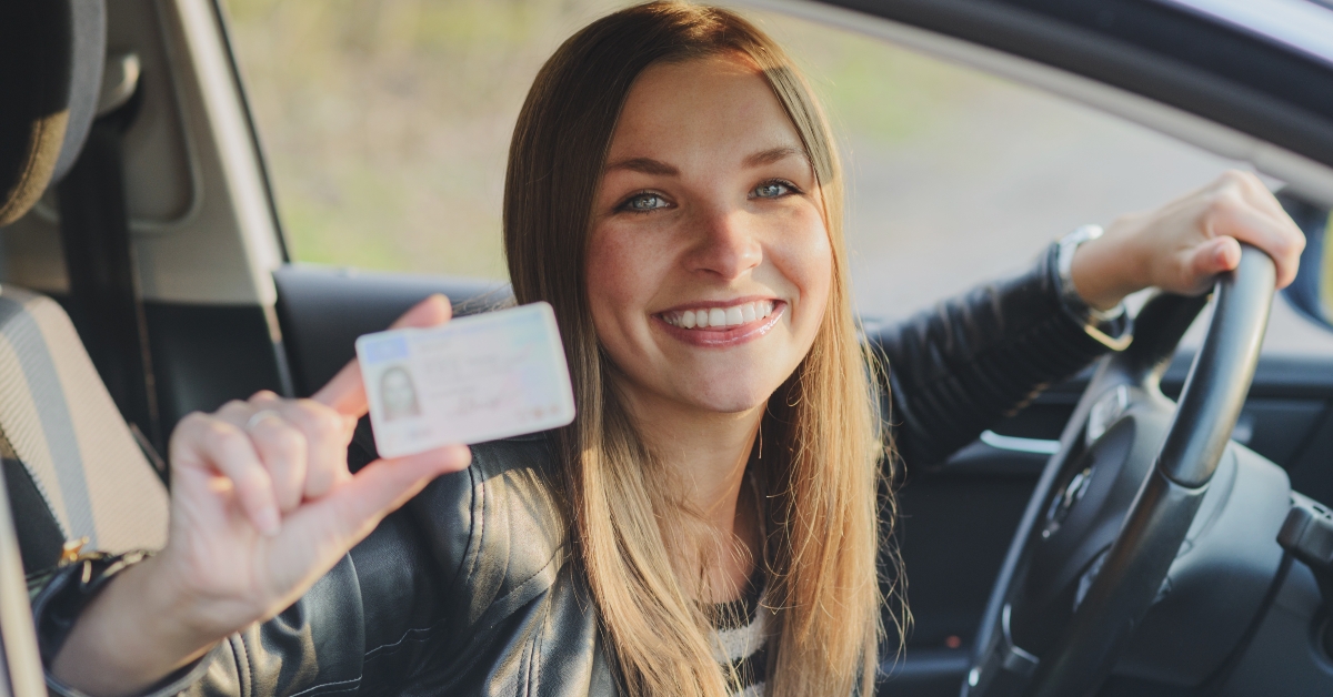 Woman showing her drivers license