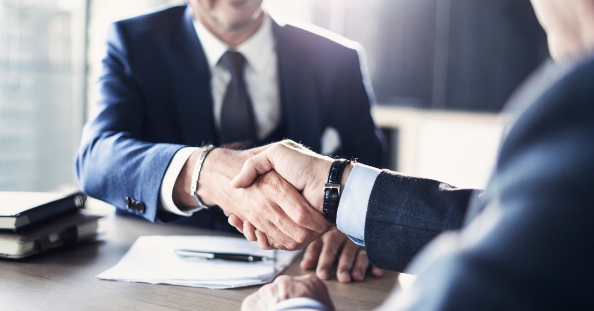 business partners shaking hands after making deal