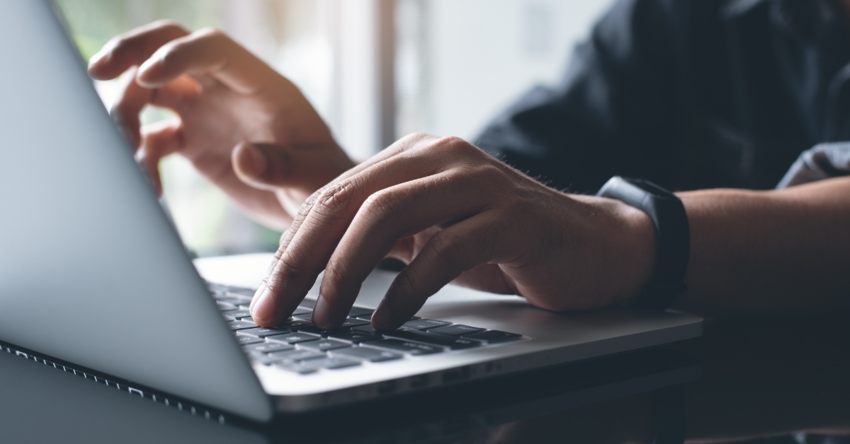man working from home using laptop