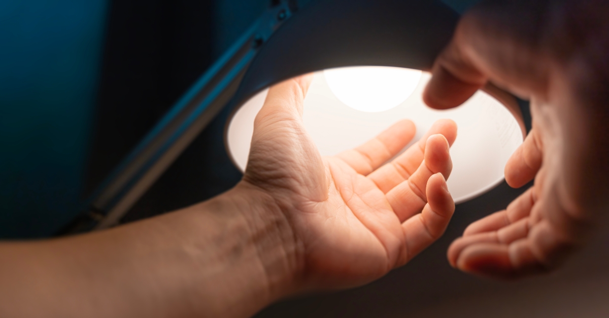 man turning into a light bulb 