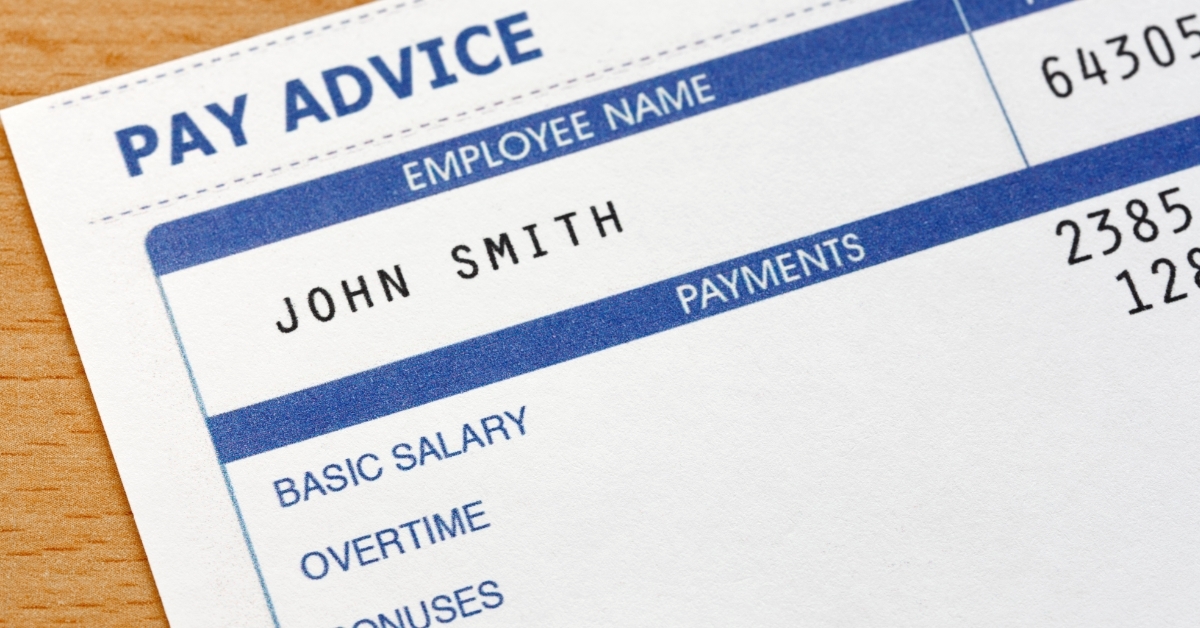 payslip on wooden table