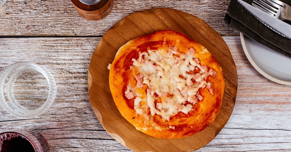 homemade pizza with ham and cheese