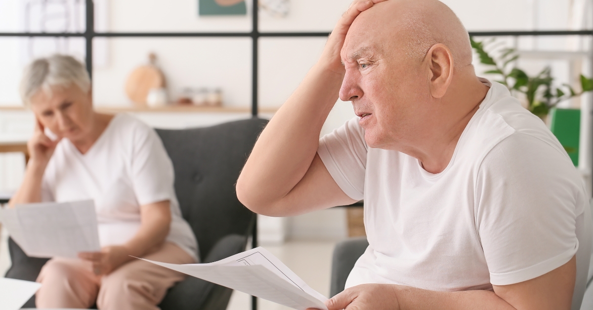 senior couple in debt