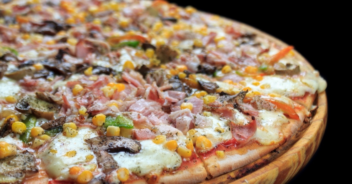 special pizza with toppings on board