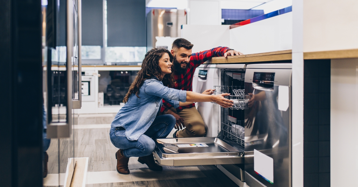 young couple buying dishwasher