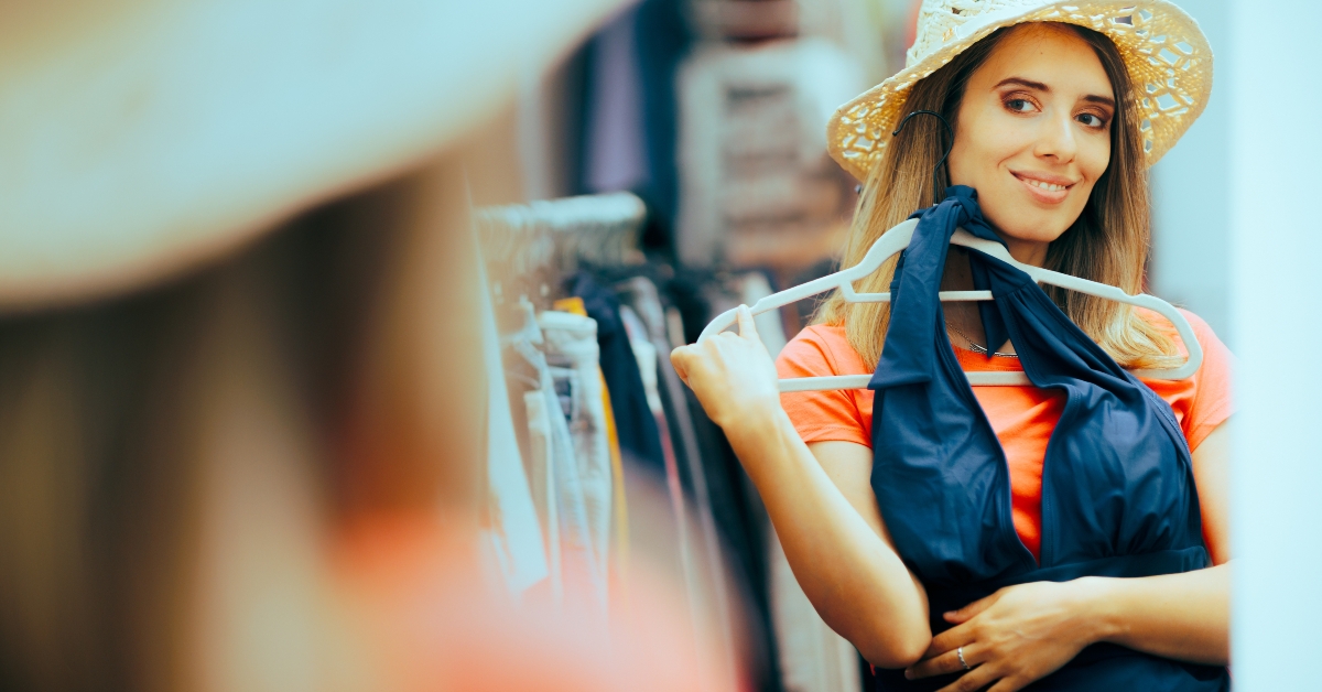 woman choosing a blue swimsuit