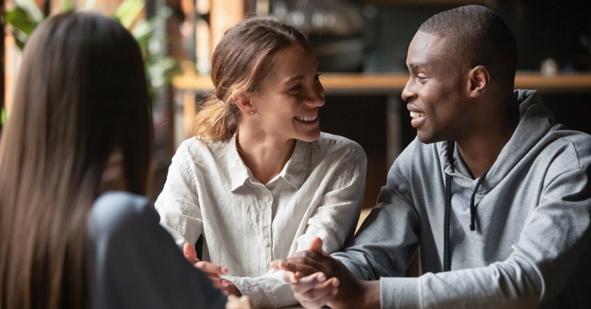 african american couple with realtor