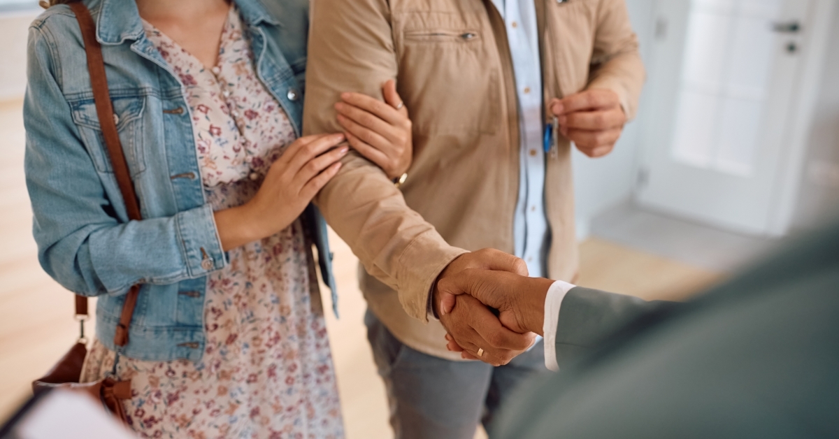 couple making agreement with realtor
