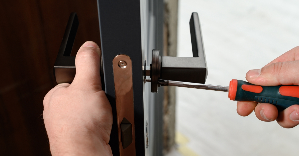 Man installing a doorknob