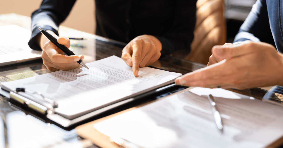 two Businesspeople Working On Contract