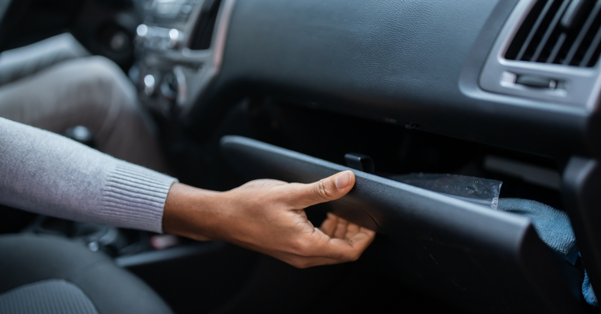 Driver Opening Glovebox Compartment