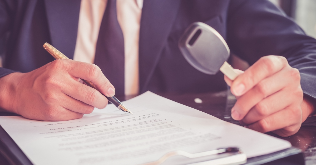 Holding key car signing contract