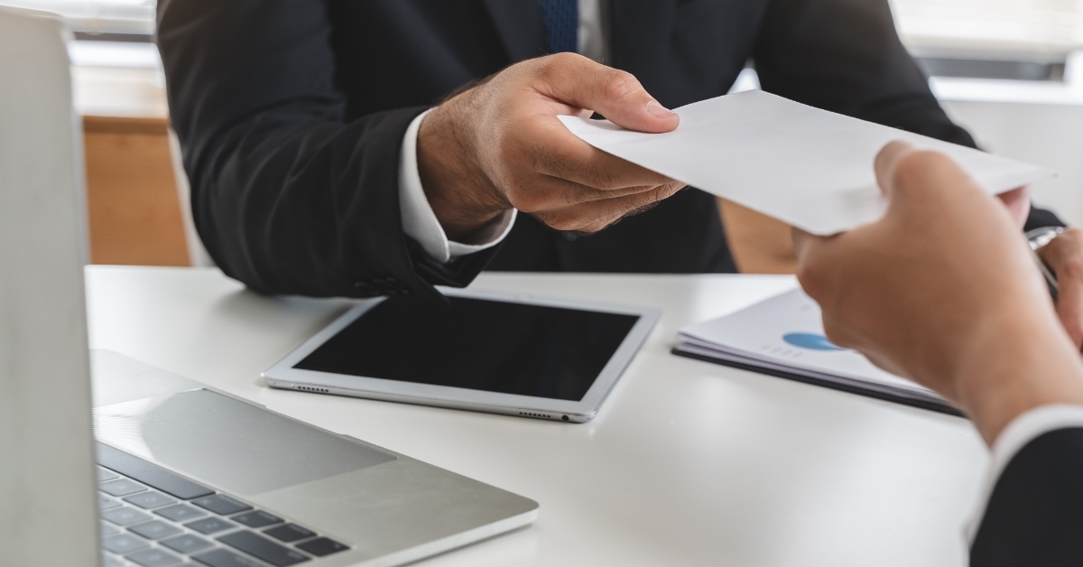 office worker receiving salary from boss