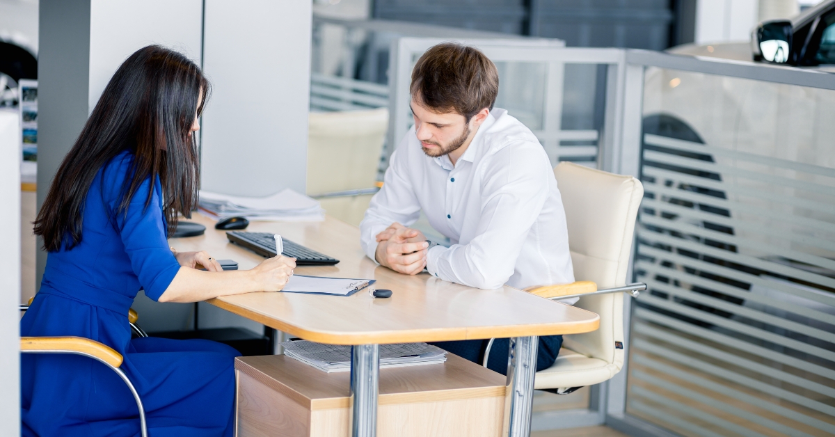Woman signing insurance papers