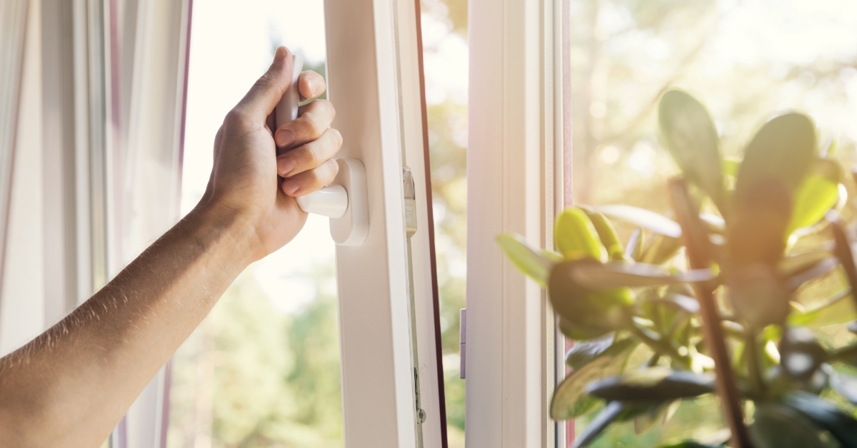 hand opening white pvc window