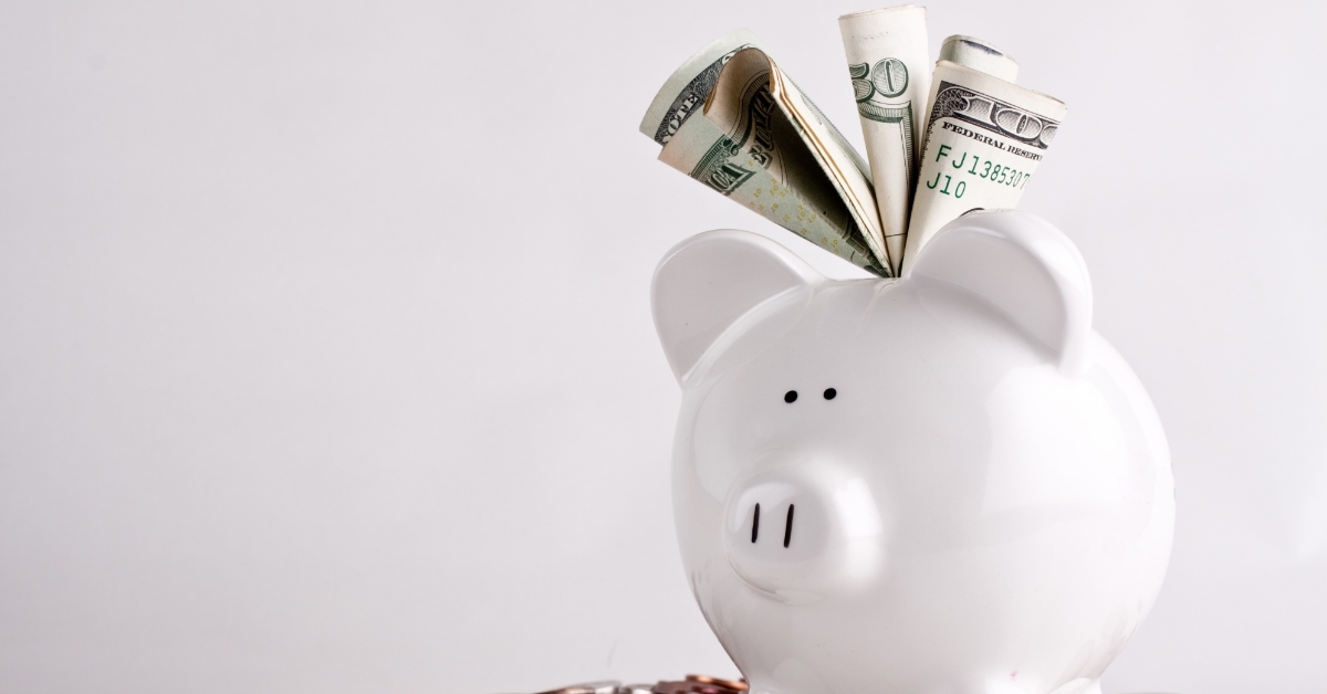 overfilled full piggy bank