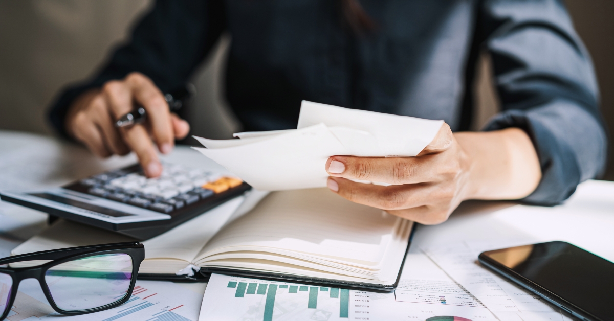 Stressed woman checking bills