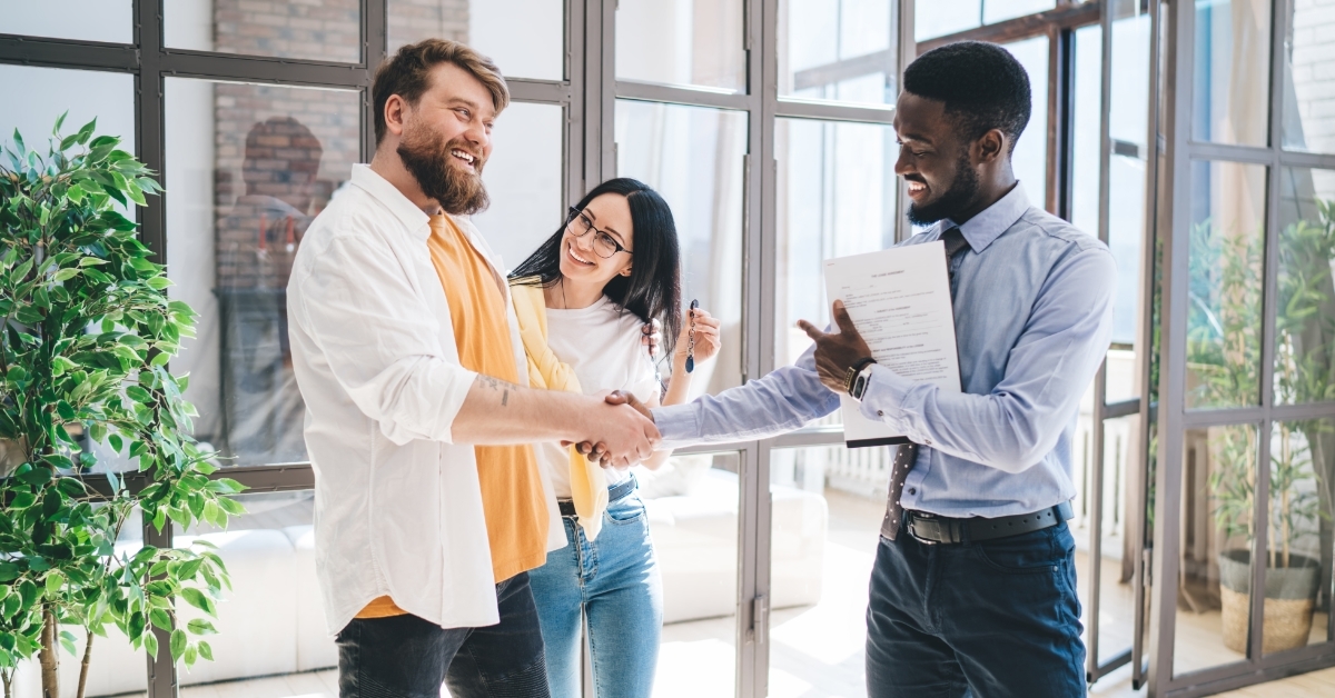 couple making deal with african american realtor
