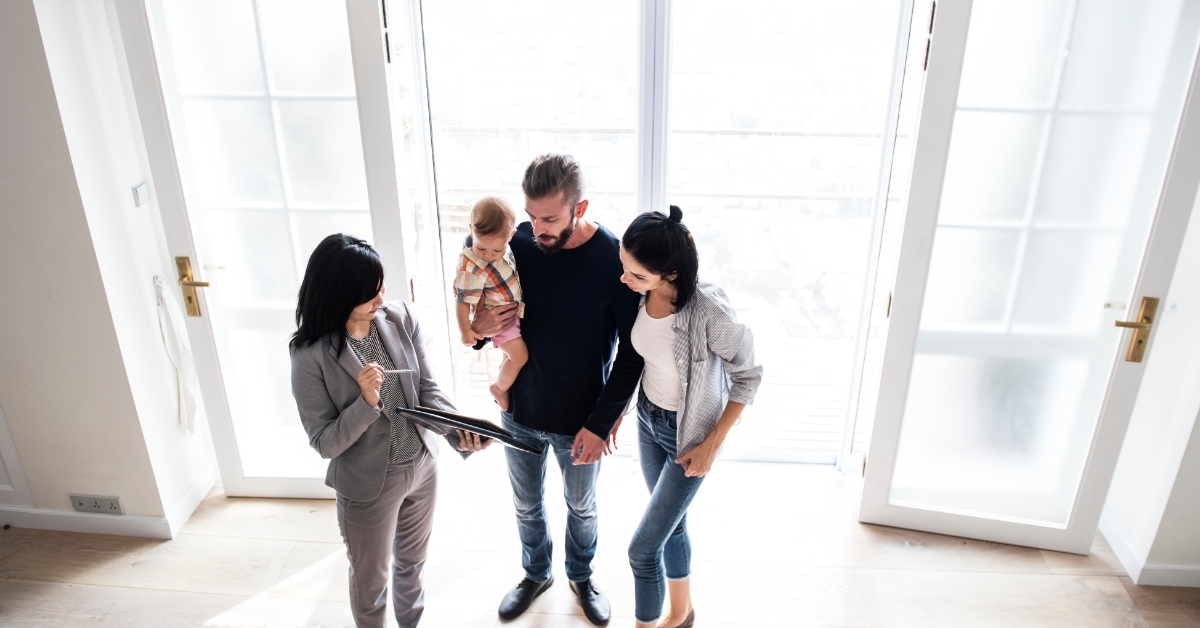 Family signing contract with realtor