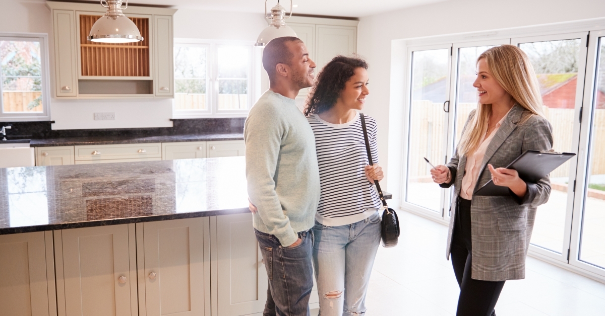 Female Realtor Showing Couple new House