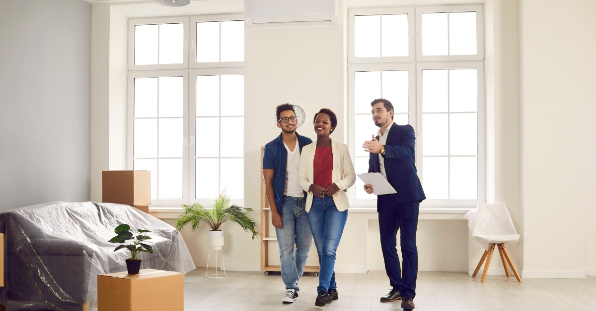 multi ethnic Couple meeting with realtor