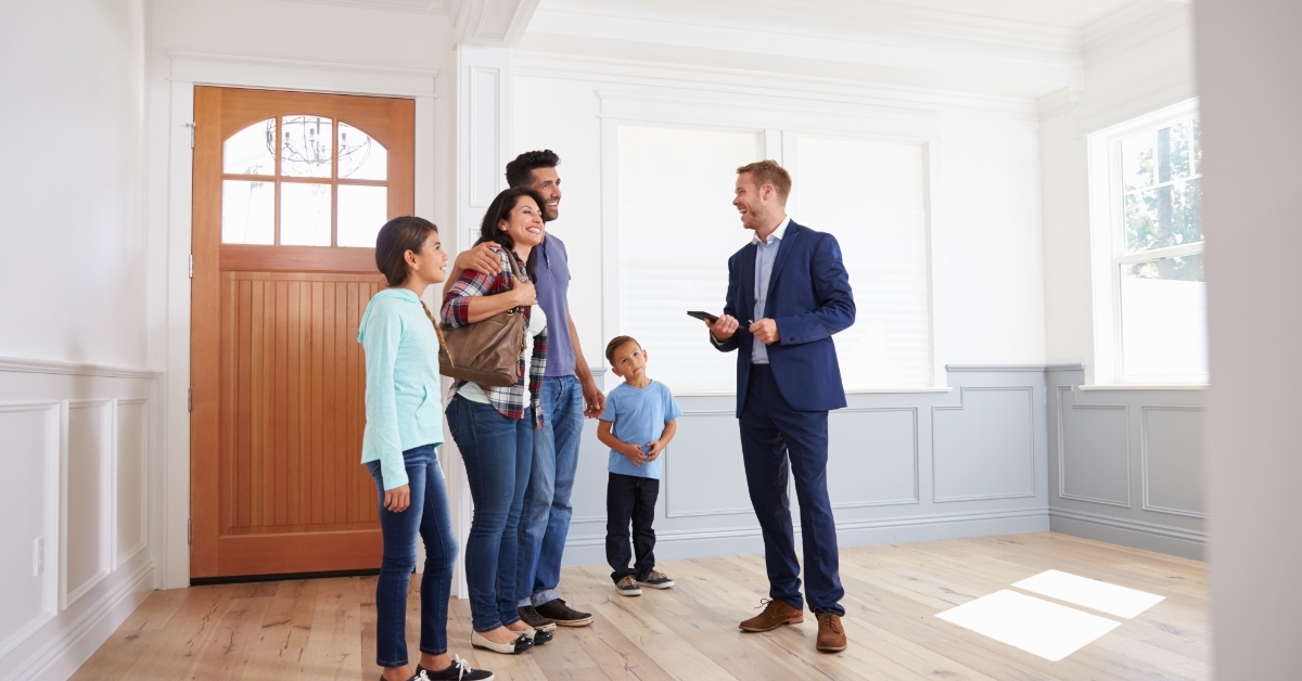 Realtor Showing Hispanic Family New Home