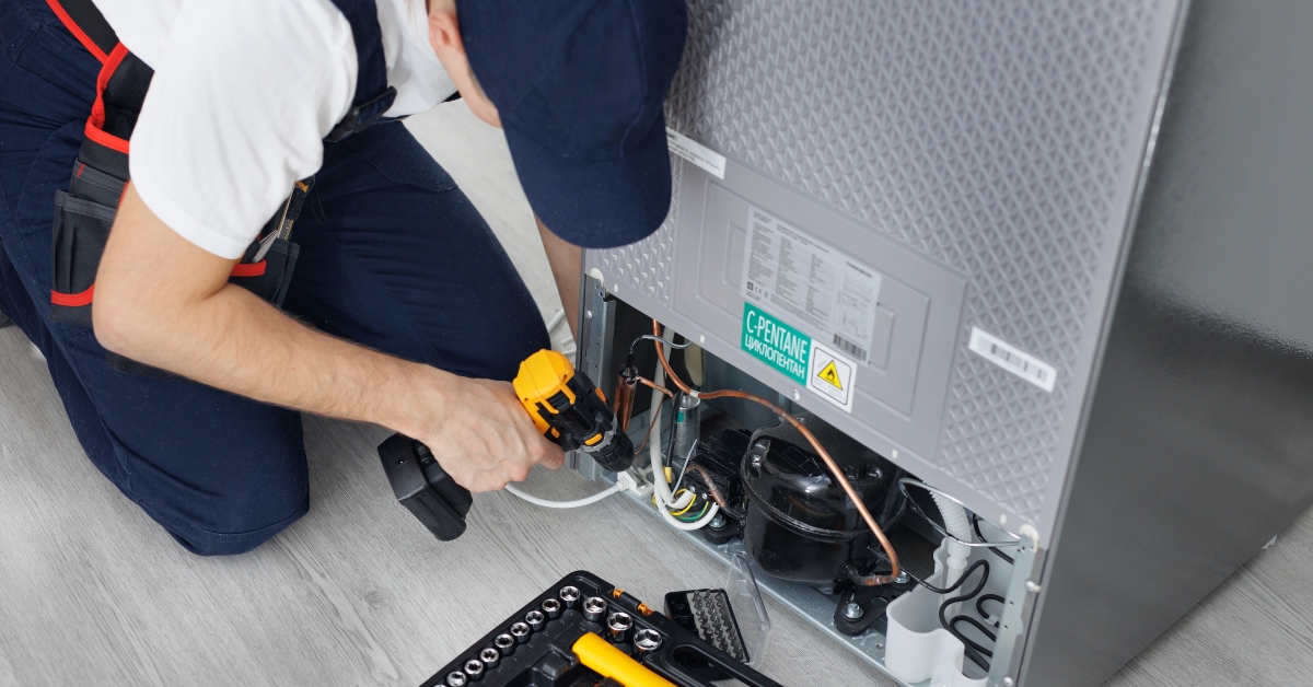  technician repairs a refrigerator 