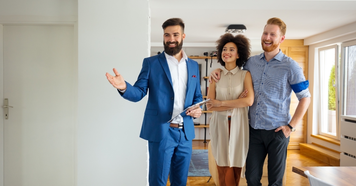 Young couple looking new home with agent