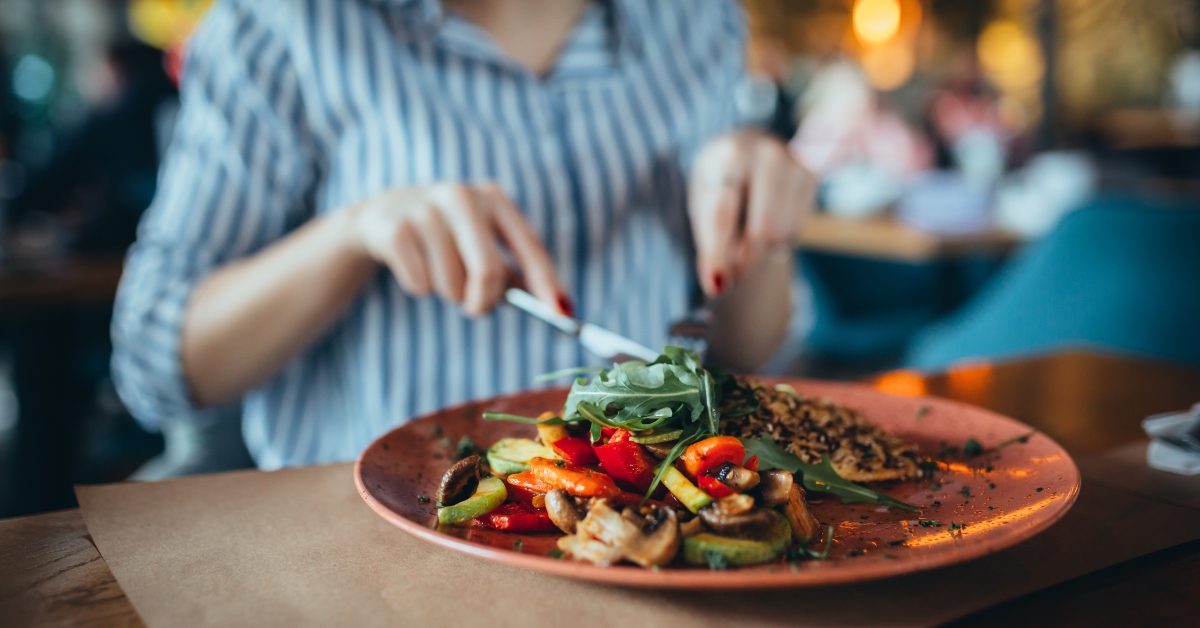 Woman in restaurant eating