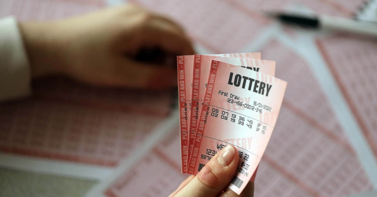 woman holding lottery tickets