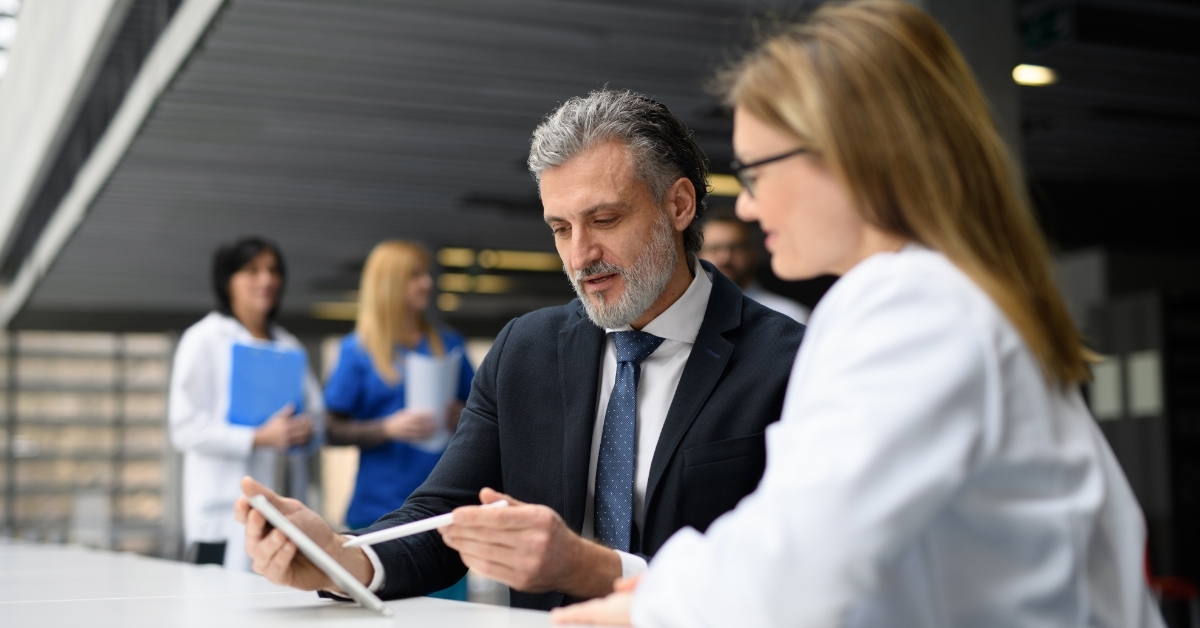 Doctor talking to pharmaceutical sales representative