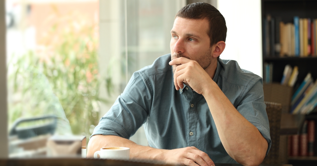 pensive man in a coffee shop