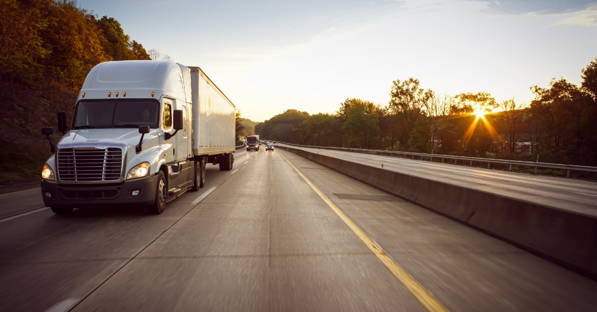 White 18 wheeler truck on highway