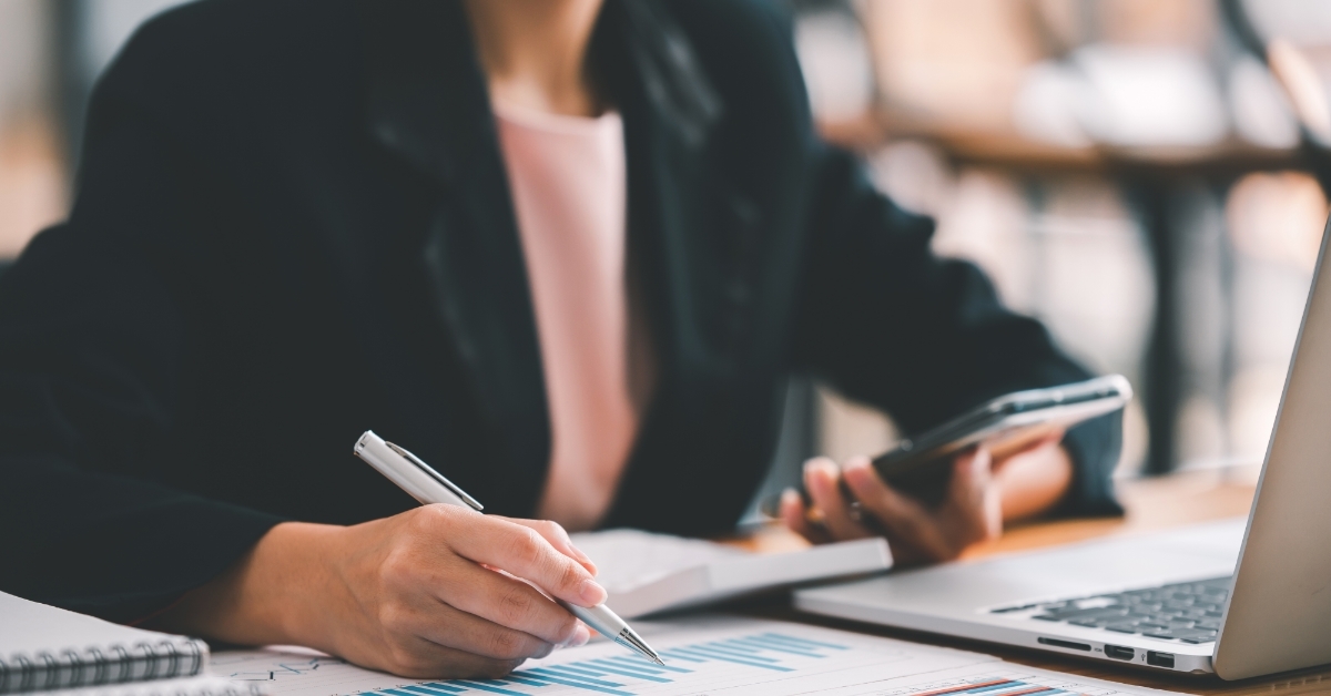 woman working at office using laptop