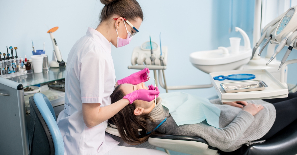 Female dentist with dental tools