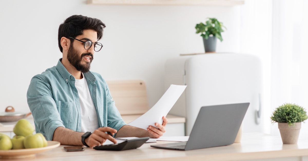guy using calculator 