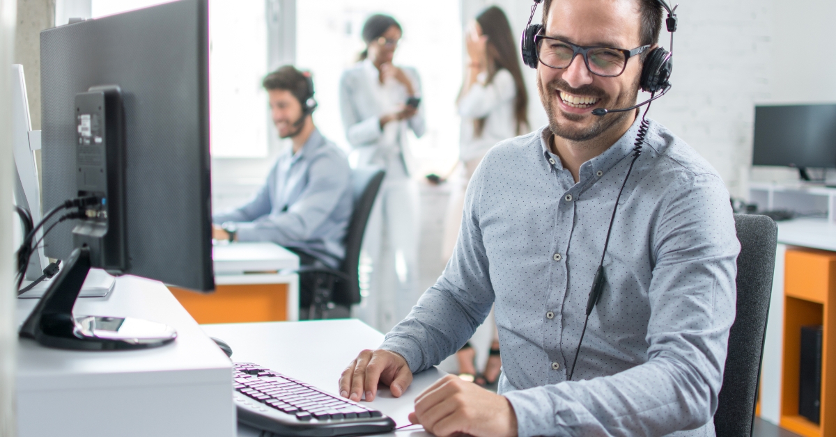 Happy young male customer support 