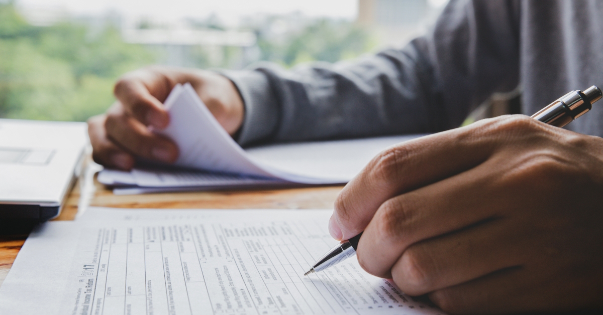 Man filling income tax forms