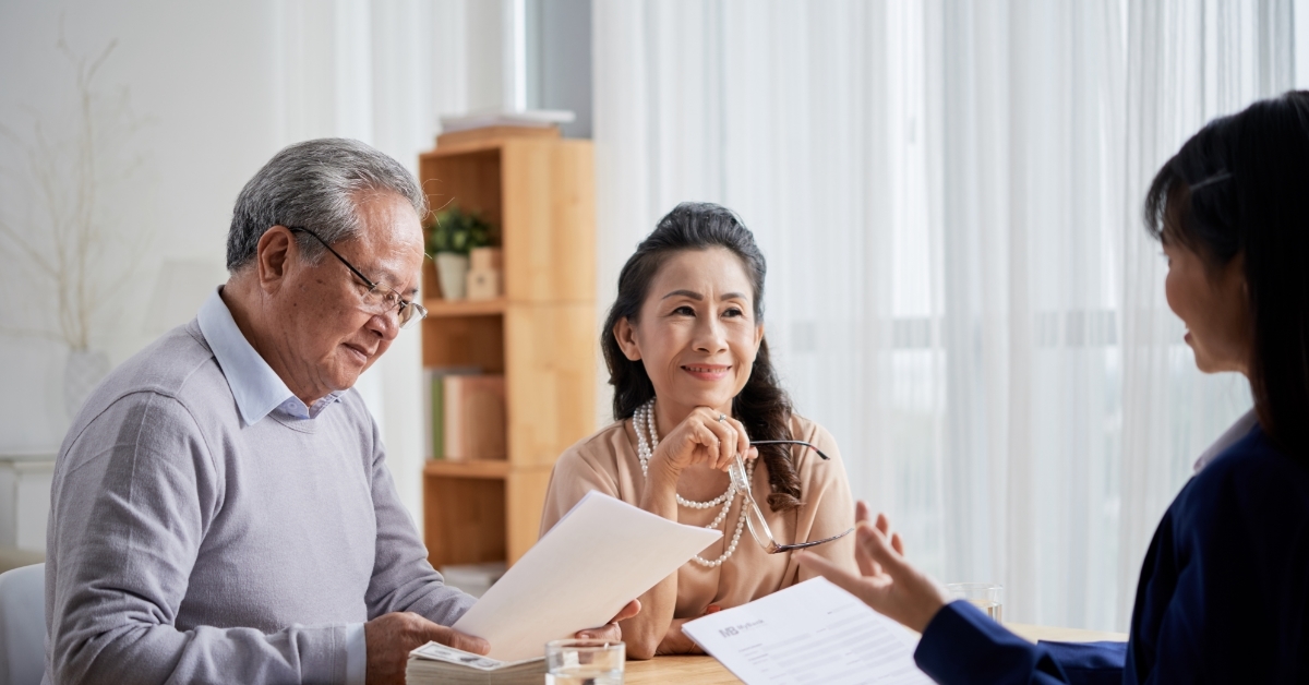 asian senior couple Consulting with estate agent