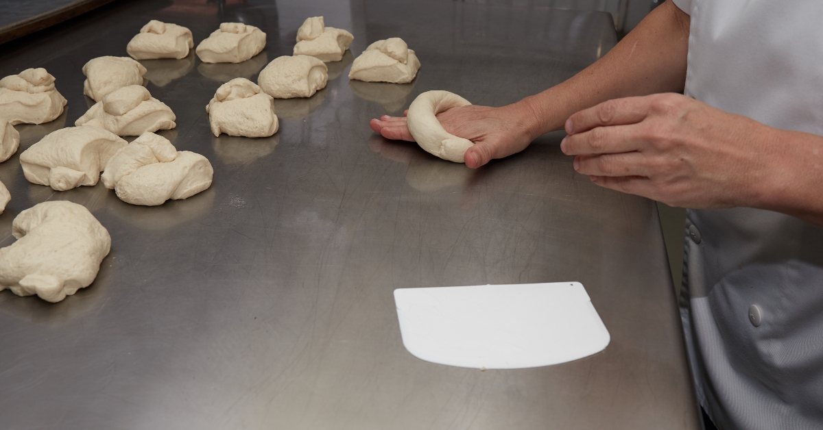 baker making bagel