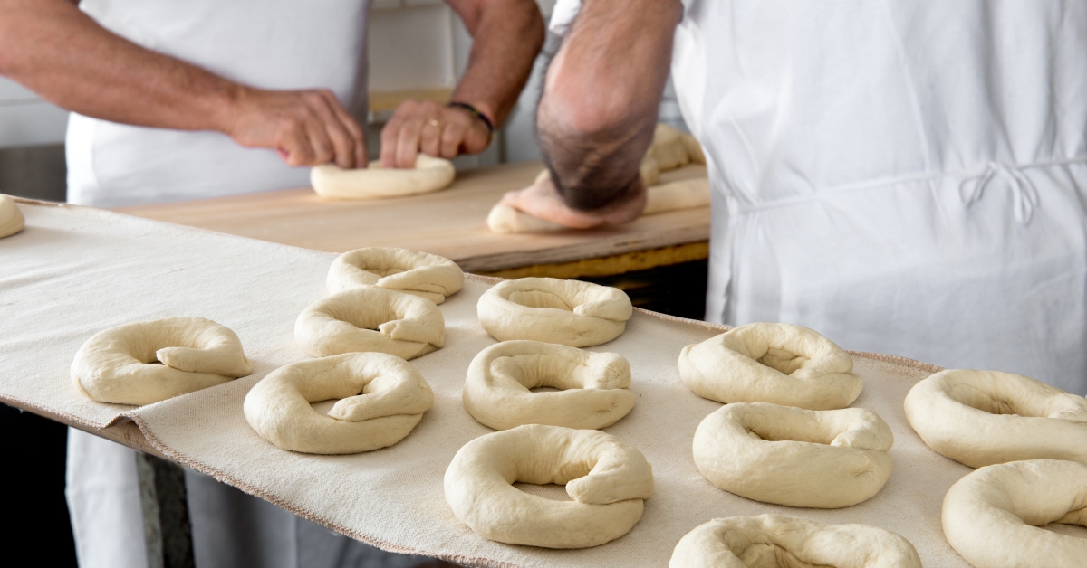 bakers making dough for bagels