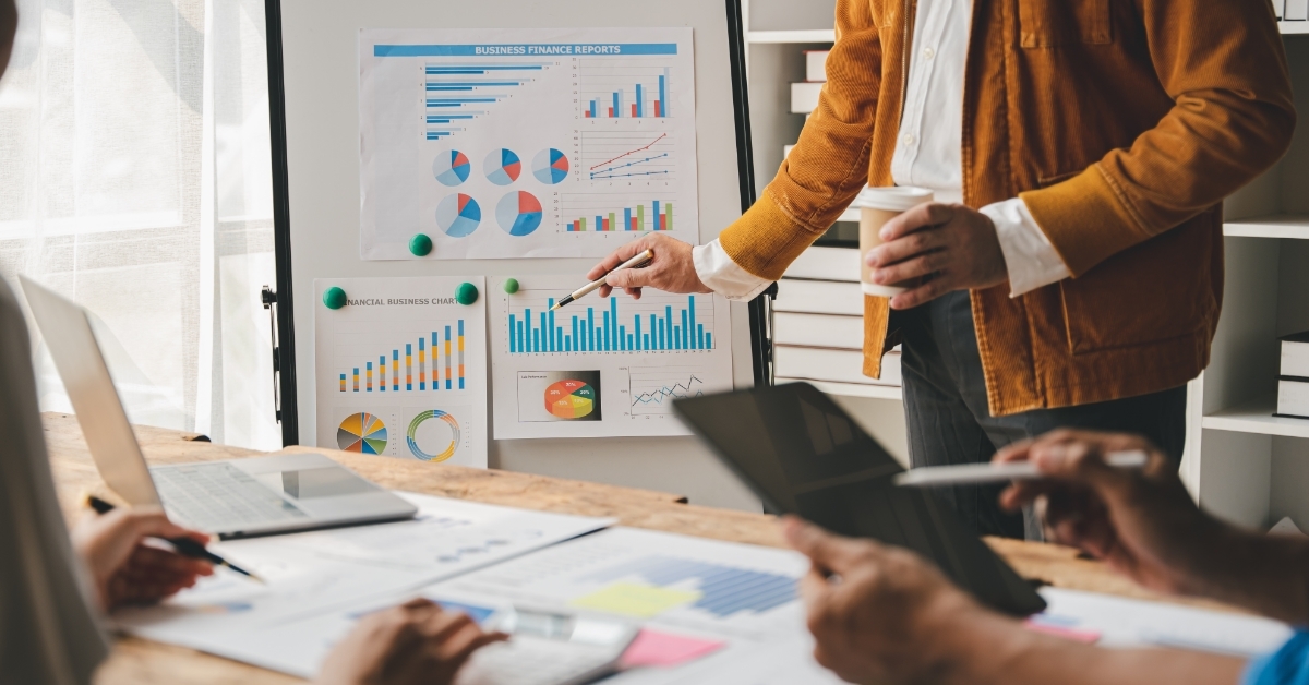 colleagues discussing business plan at work