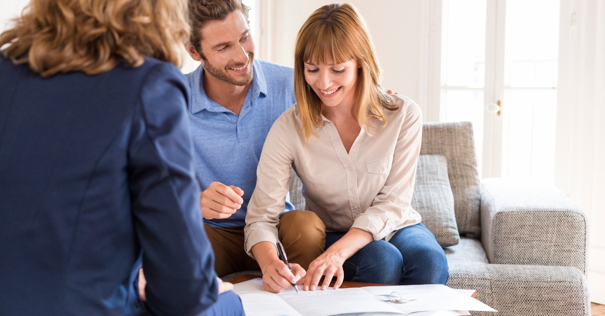 Couple meeting real estate agent