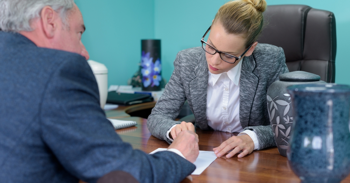 Funeral director completing paperwork