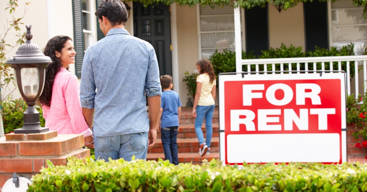 happy family outside home for rent