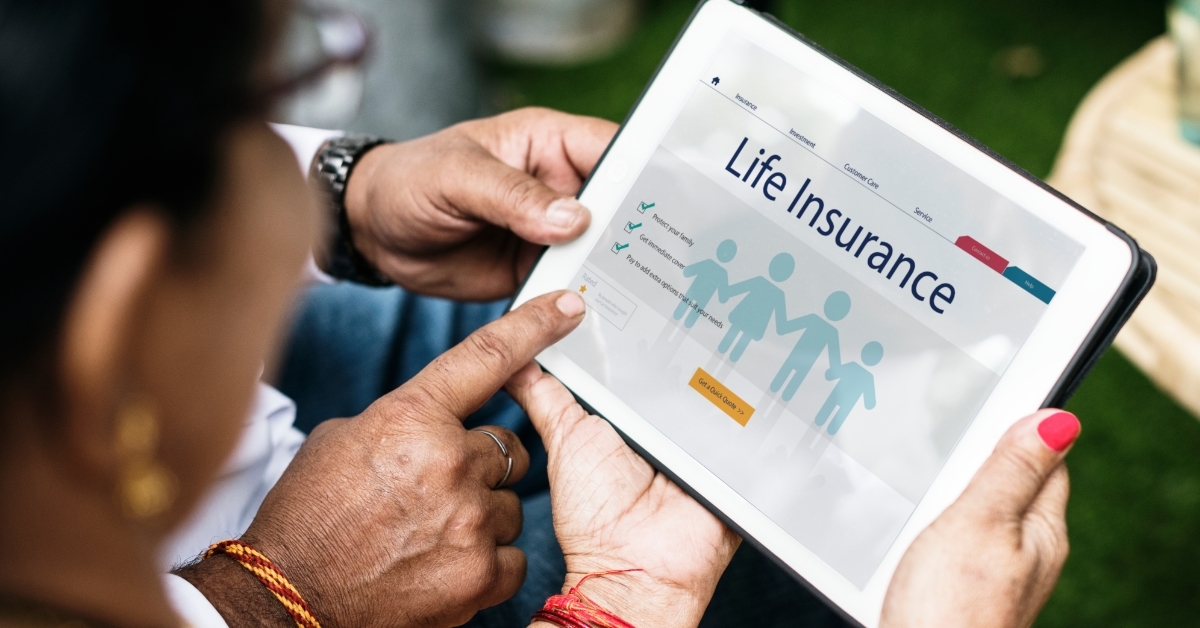 indian family reviewing insurance policy on tablet