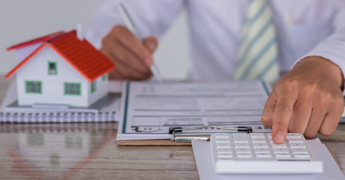 man calculating bills property insurance concept