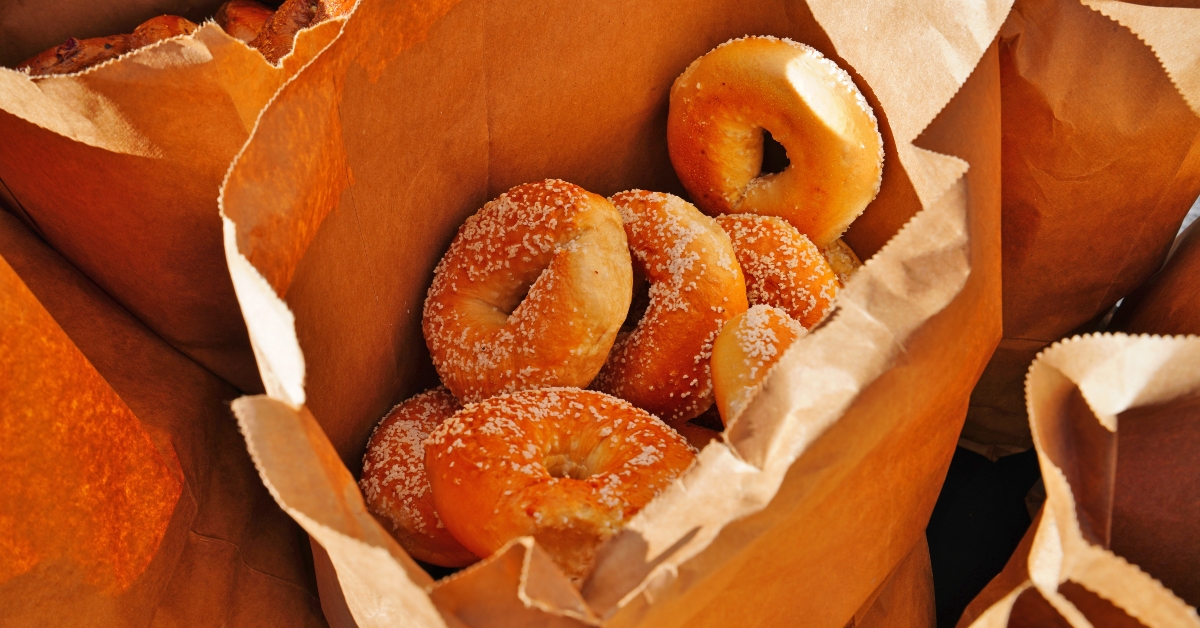 fresh bagels in a paper bag