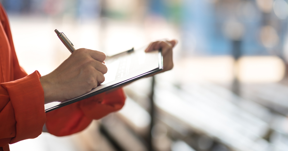 officer writing on safety checklist