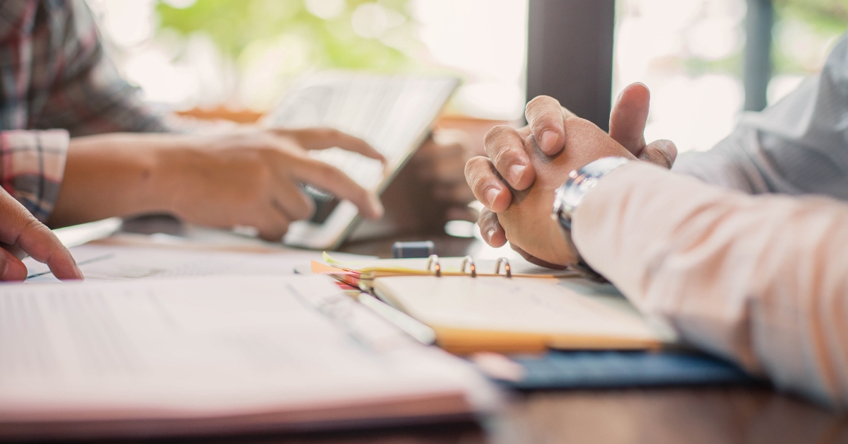 Business people negotiating a contract